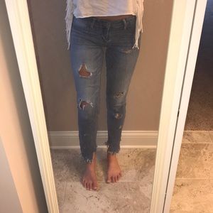 Ripped and frayed bottom jeans